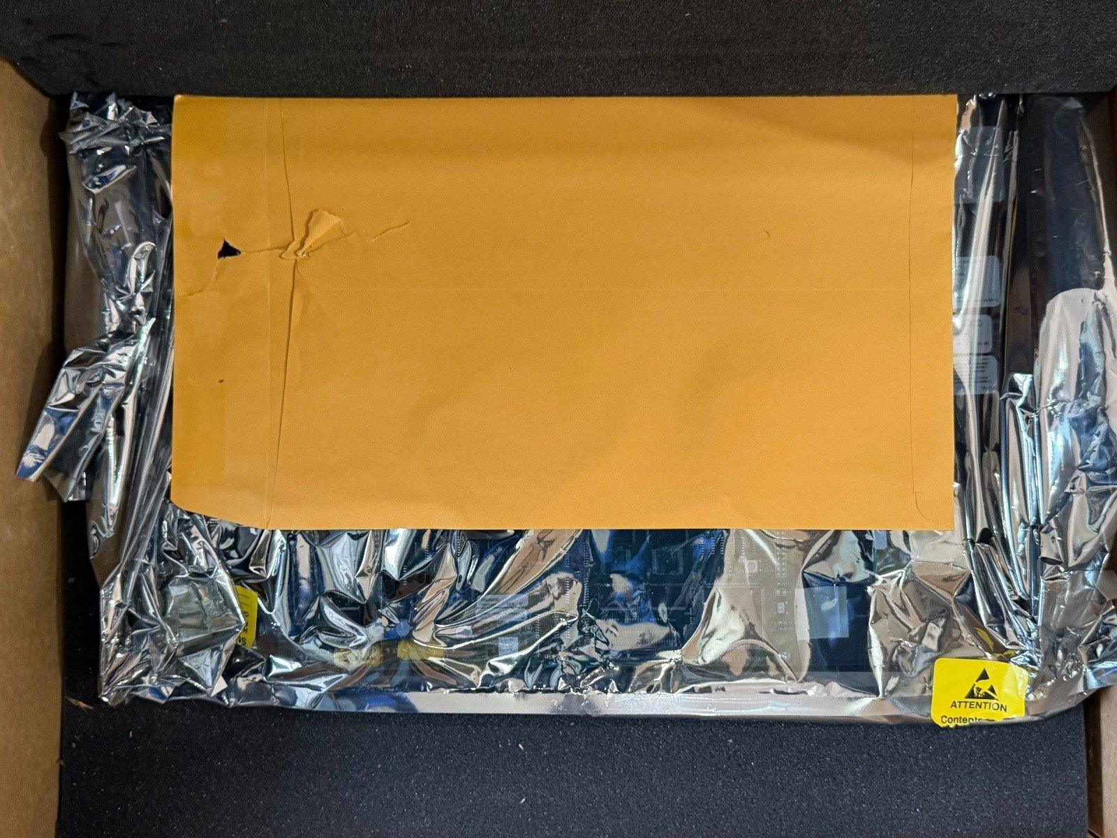Fire alarm equipment packaged in anti-static bag with yellow envelope and warning label inside box