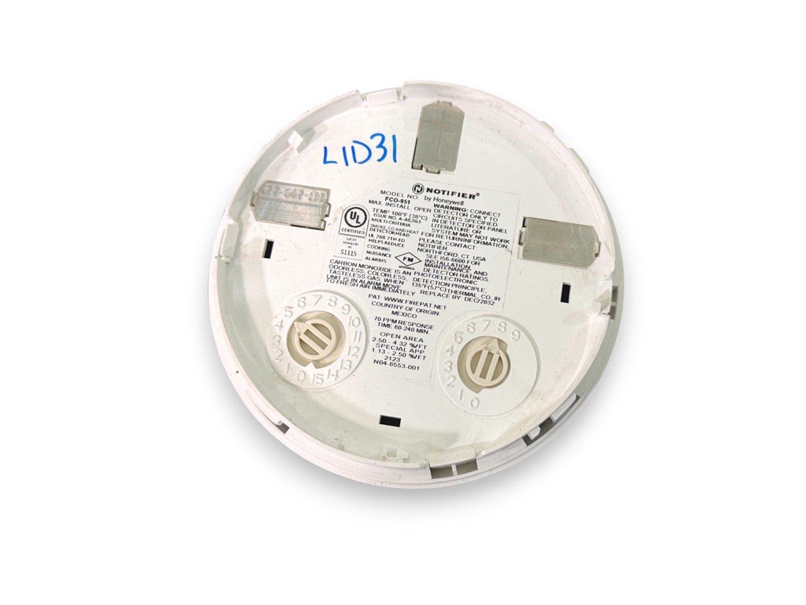 Notifier FCO-951 smoke detector backplate with UL listing and installation labels