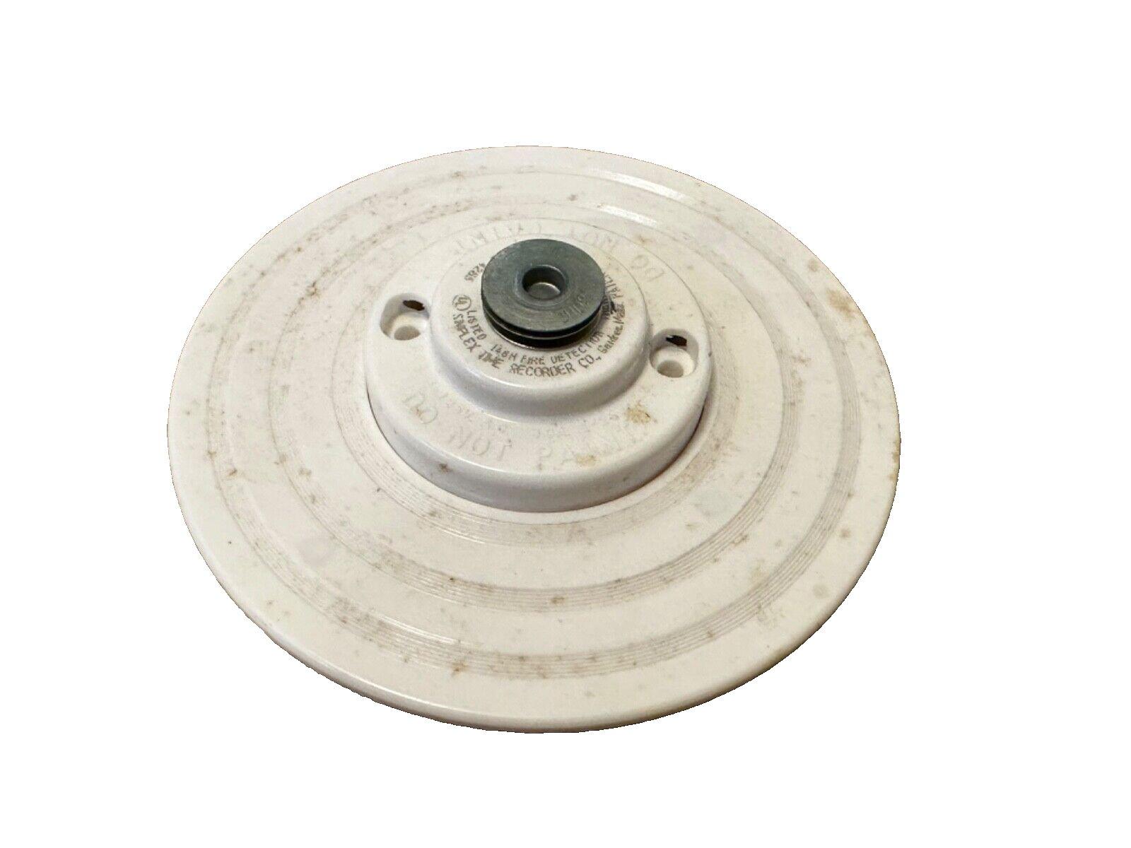 Used Simplex 148M fire detector base, white circular housing with mounting holes, for fire alarm systems