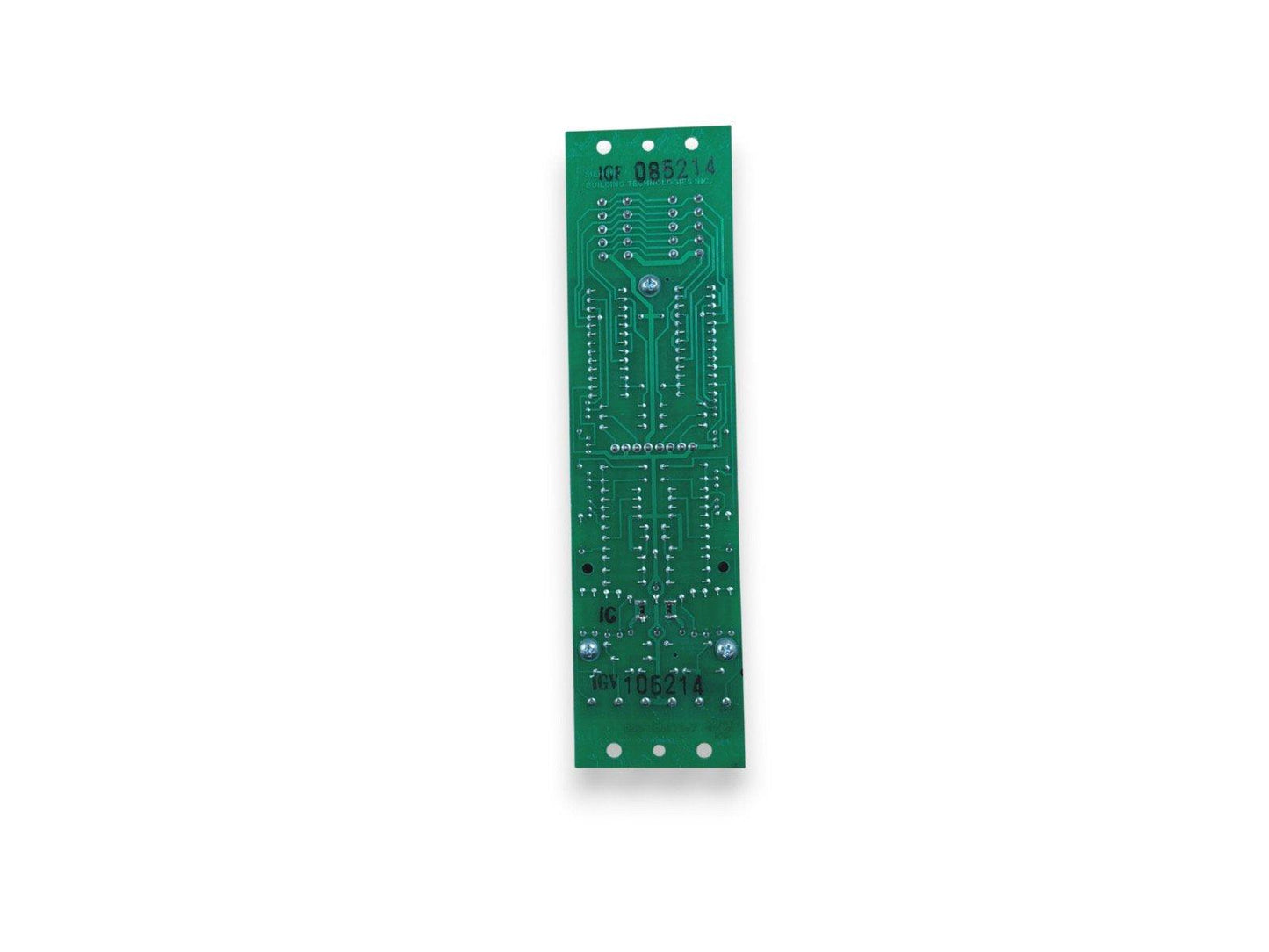 Green fire alarm control panel circuit board with solder points and mounting holes