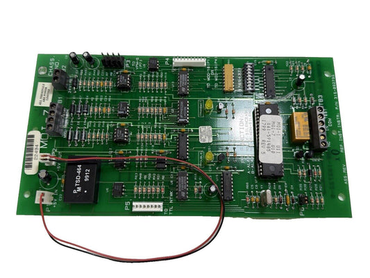 Fire alarm control panel circuit board with resistors, ICs, and connectors for fire safety systems