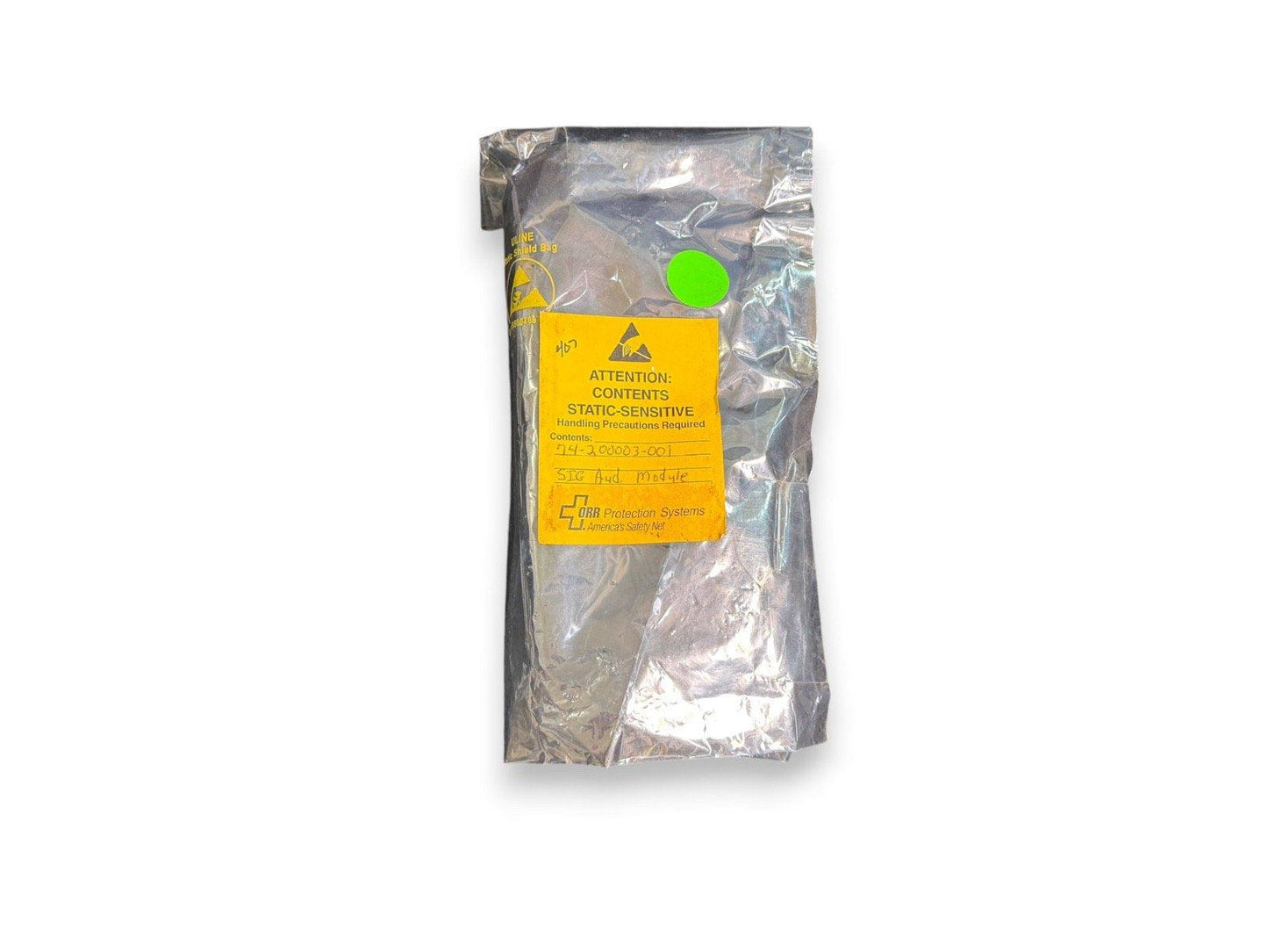 Static-sensitive fire alarm module in anti-static bag, labeled ORR Protection Systems for safety